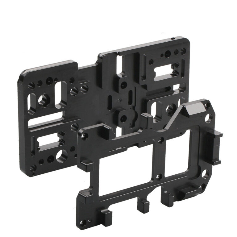 Black machined Delrin POM mounting plate with pockets and bores