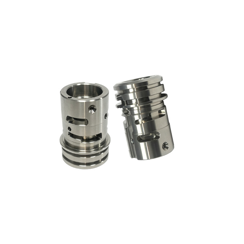 CNC machined stainless steel valve cages with milled windows and external grooves, machined by GY Machining
