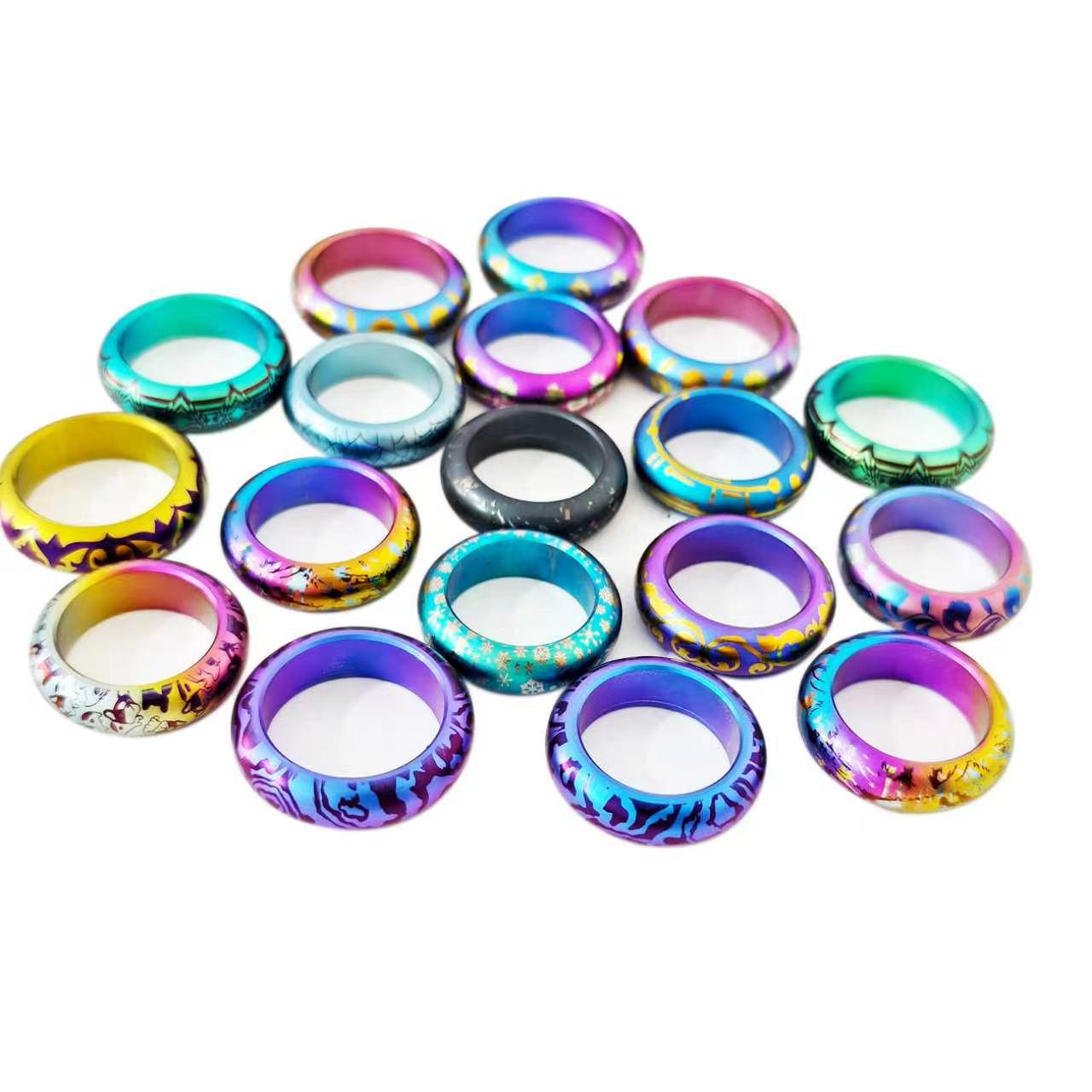 Anodised titanium rings in a range of colours and printed patterns