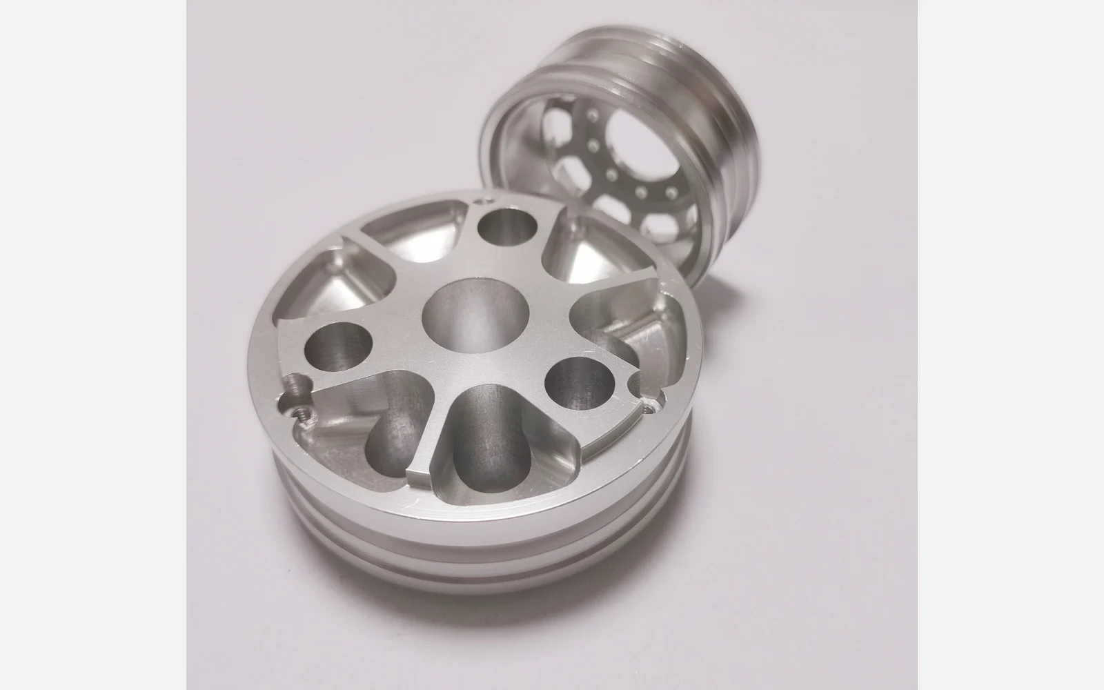 CNC machined aluminium prototype wheel hubs with spoke pockets, milled and turned by GY Machining