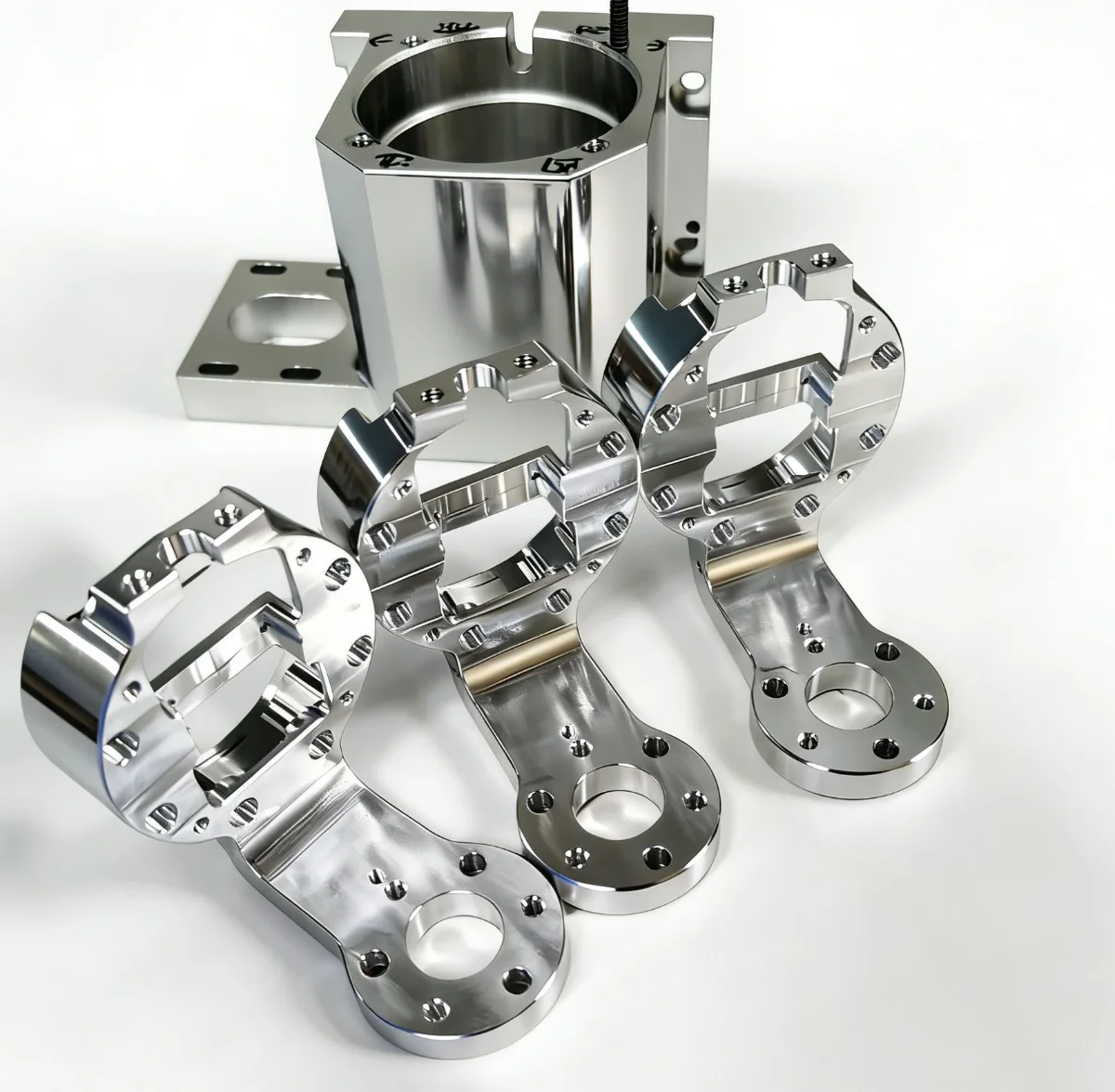 Polished CNC machined aluminium robot joint links and motor swing-arm brackets for gimbals, drones and small robotic arms, machined by GY Machining