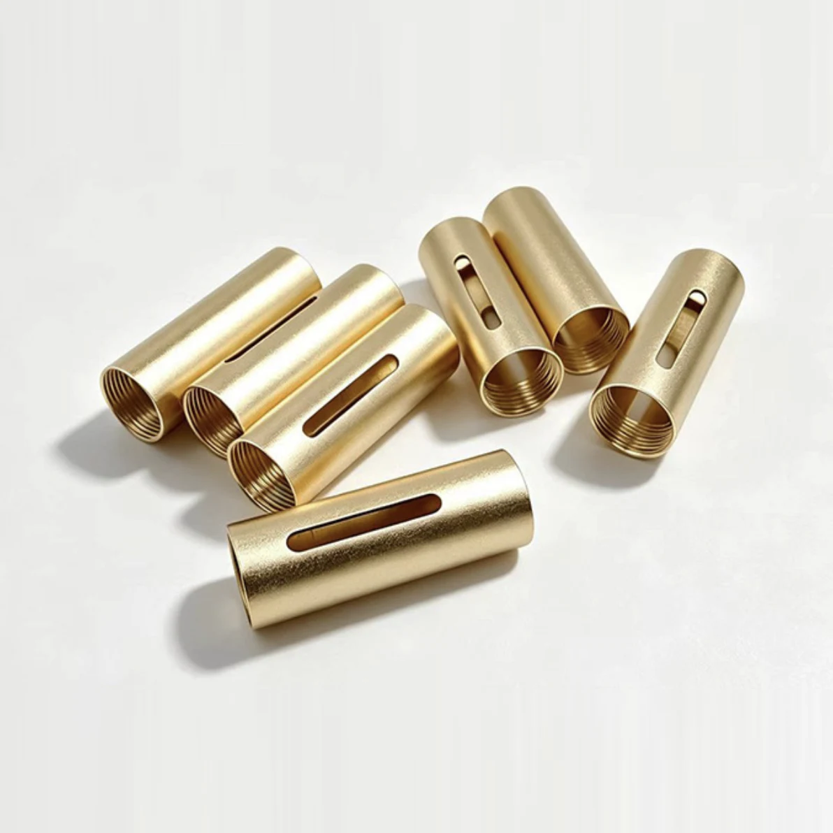 CNC machined brass sleeves with internal threads and milled side slots