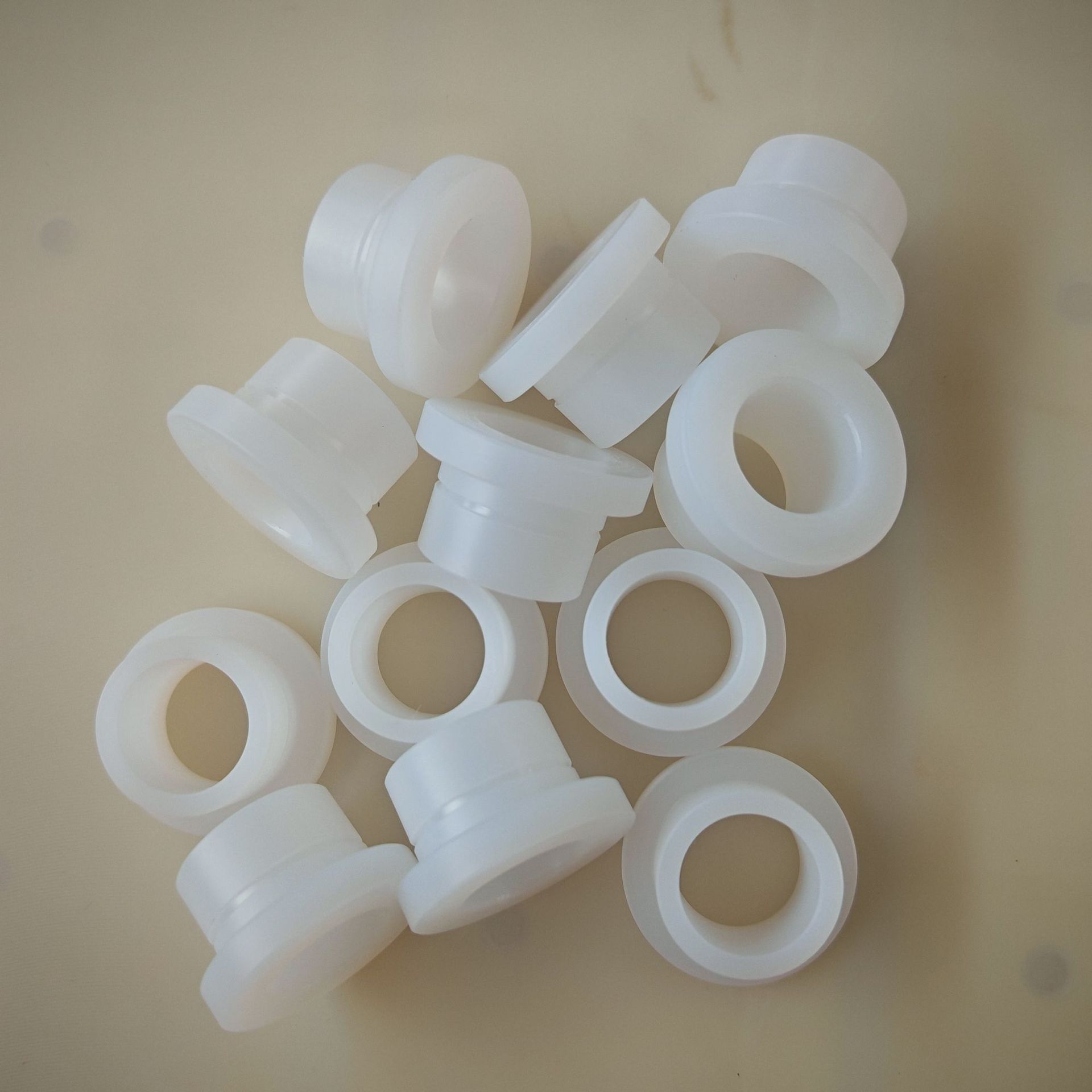 CNC machined nylon flanged bushings