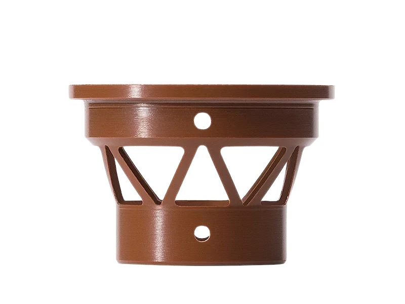 CNC machined polyimide cage part with triangular window cutouts, a flange and cross-drilled holes
