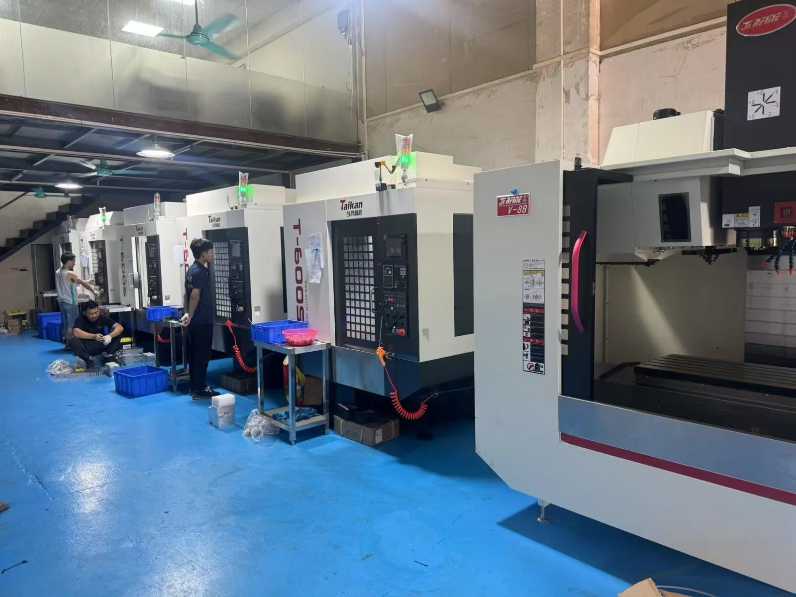 Row of vertical CNC machining centres on the GY Machining shop floor in Dongguan
