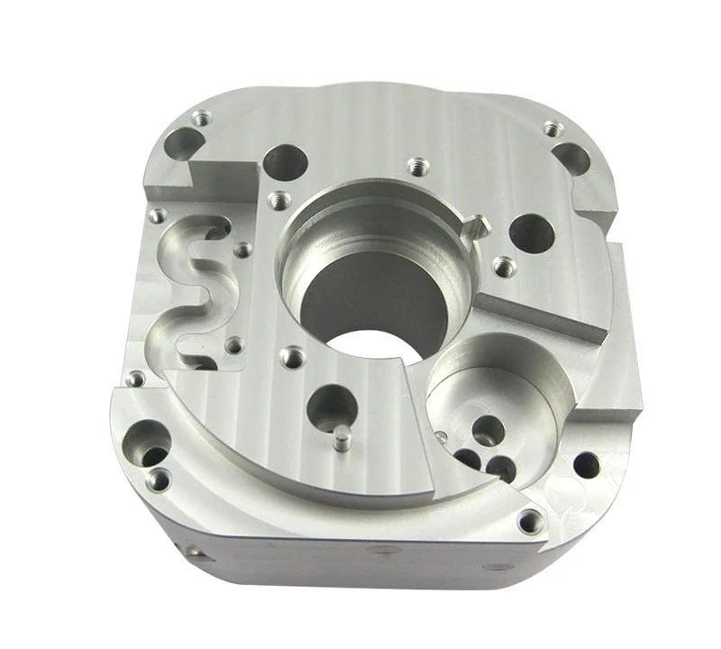CNC milled aluminium manifold housing block with stepped bores, pockets and tapped holes, machined by GY Machining