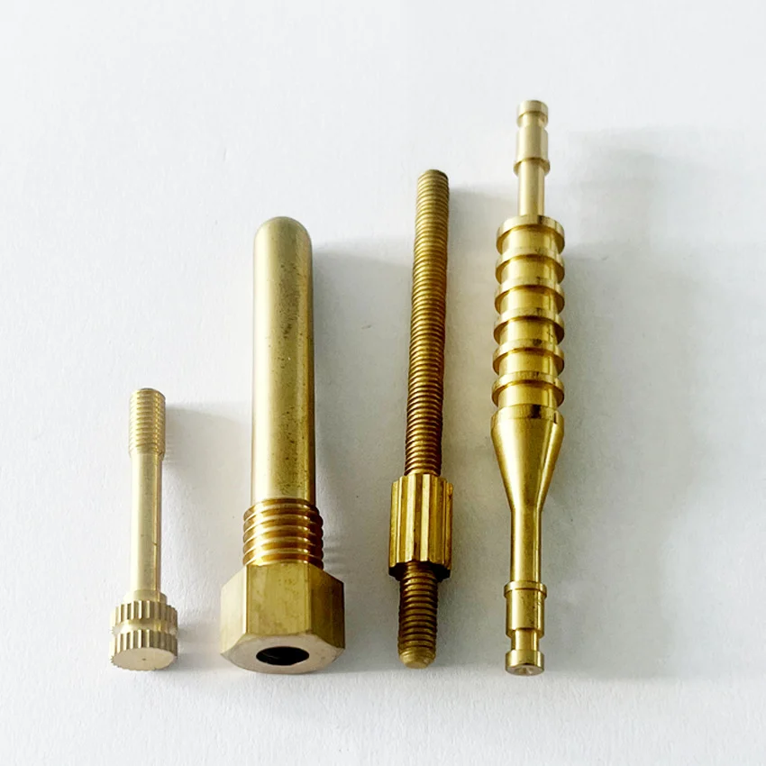 Small CNC turned brass screws, studs and a barbed nozzle
