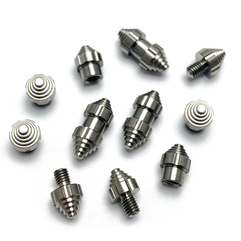 CNC turned titanium fittings and threaded inserts