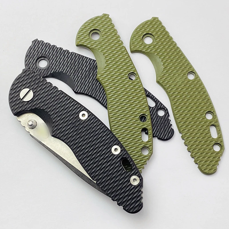 Black and OD green G10 knife handle scales with milled weave texture, one set fitted to a folding knife