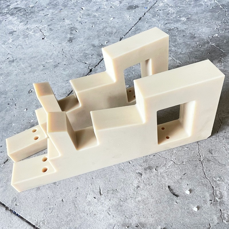 Machined nylon stepped guide rail with cut-outs