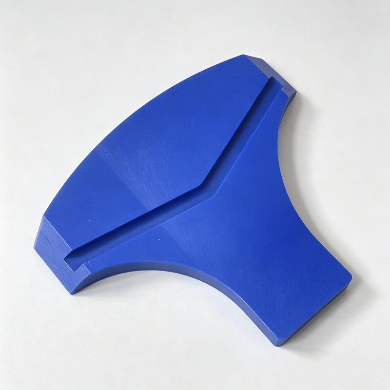 Machined blue nylon curved wear plate