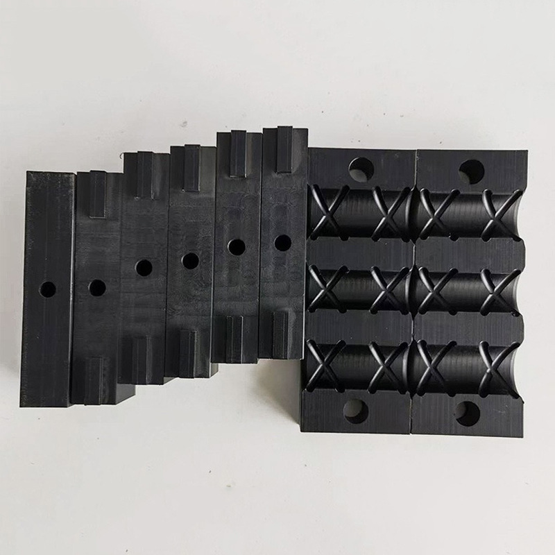 Machined black nylon clamp jaws and location blocks