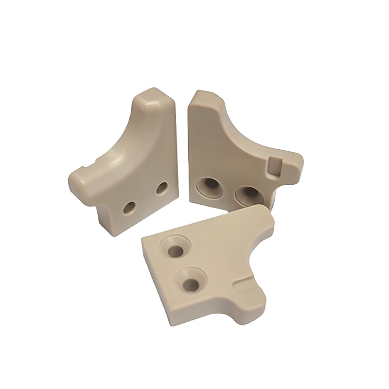 Machined PEEK corner brackets with counterbored holes — PEEK, CNC machined at GY Machining