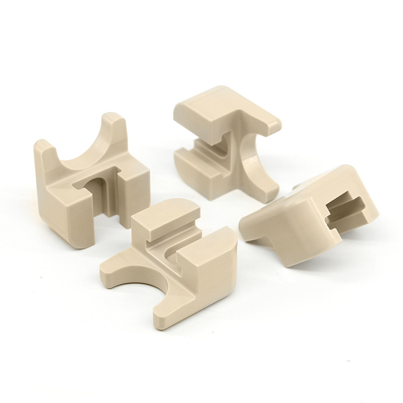 Machined PEEK saddle clips for tube or rod — PEEK, CNC machined at GY Machining