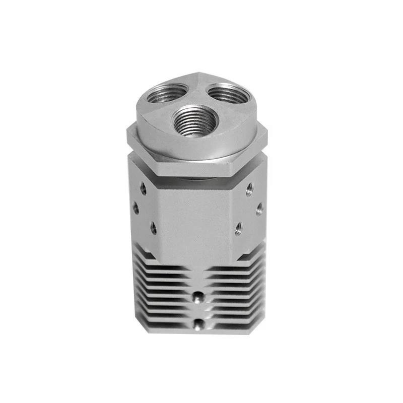 Machined aluminium hex manifold with finned body and three threaded ports – GY Machining