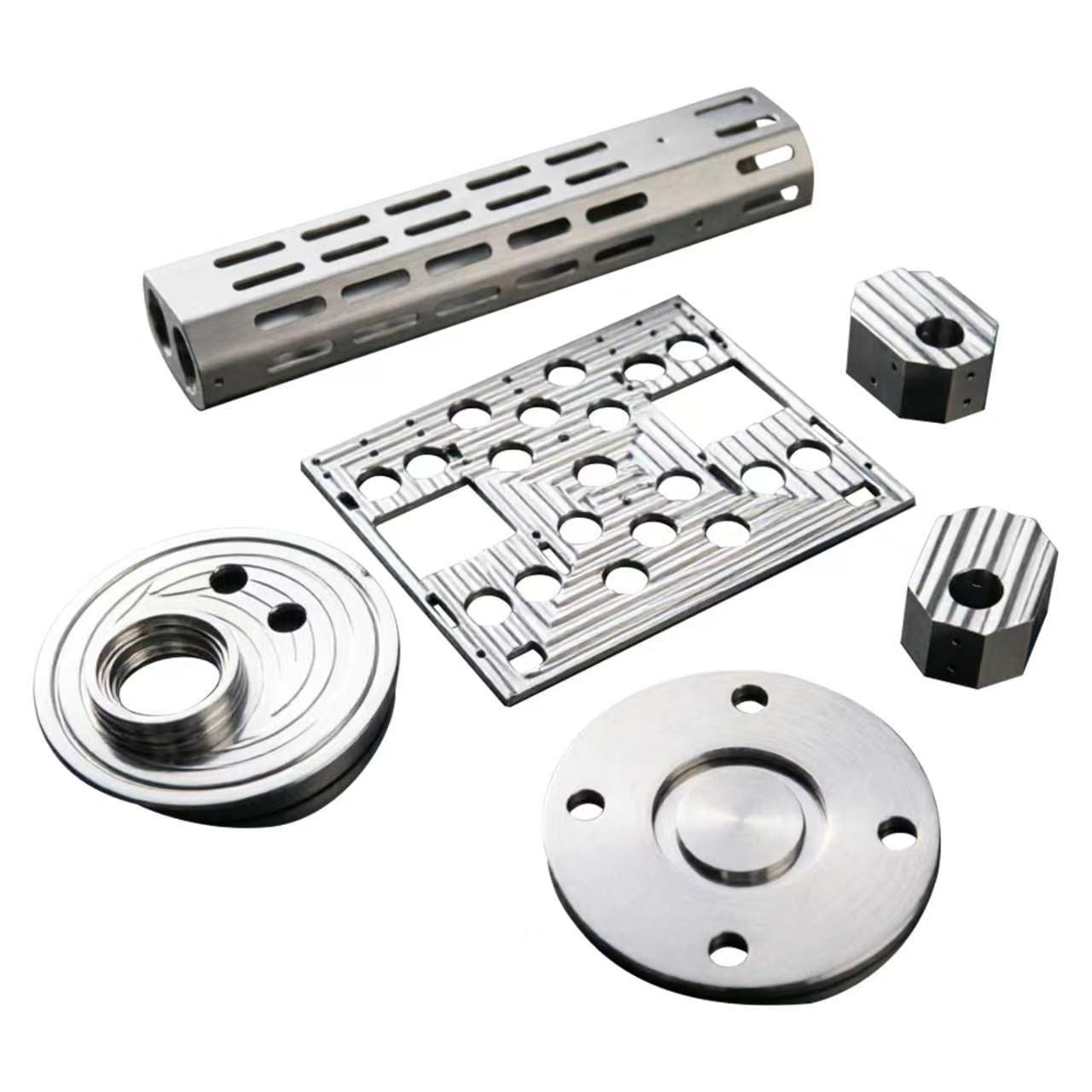 Batch of machined aluminium parts: slotted tube, pocketed plate, knurled blocks and round flanges &ndash; GY Machining