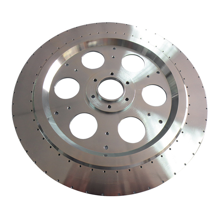 Turned and milled aluminium rotor disc with lightening holes and a drilled hole pattern – GY Machining