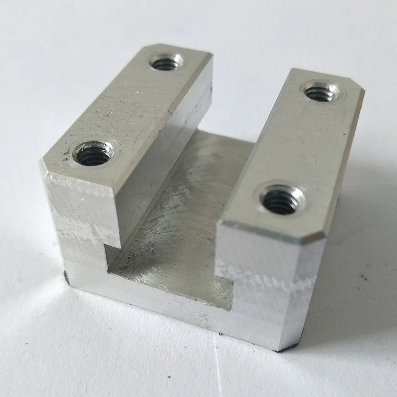 Machined aluminium U-shaped block with four tapped holes – GY Machining