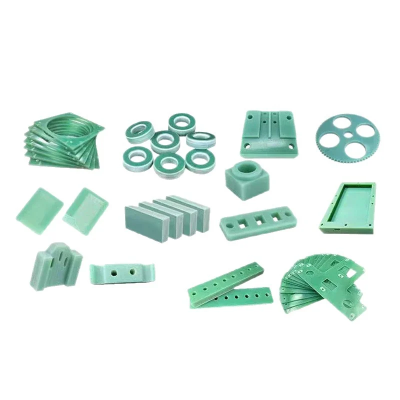 Mixed batch of machined G10 parts: rings, blocks, plates and a gear &ndash; GY Machining