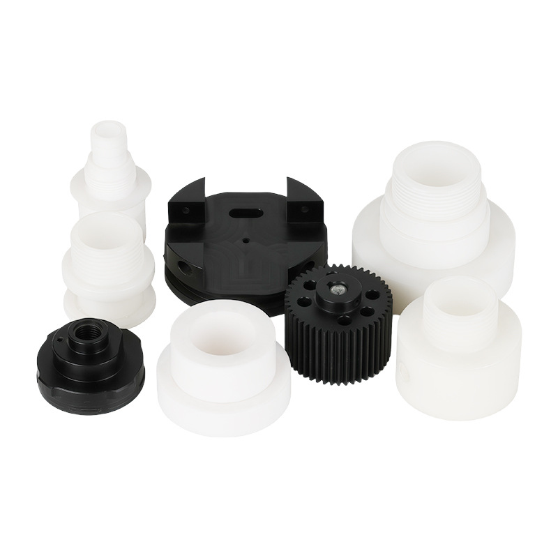 CNC machined POM adapters, caps and a gear