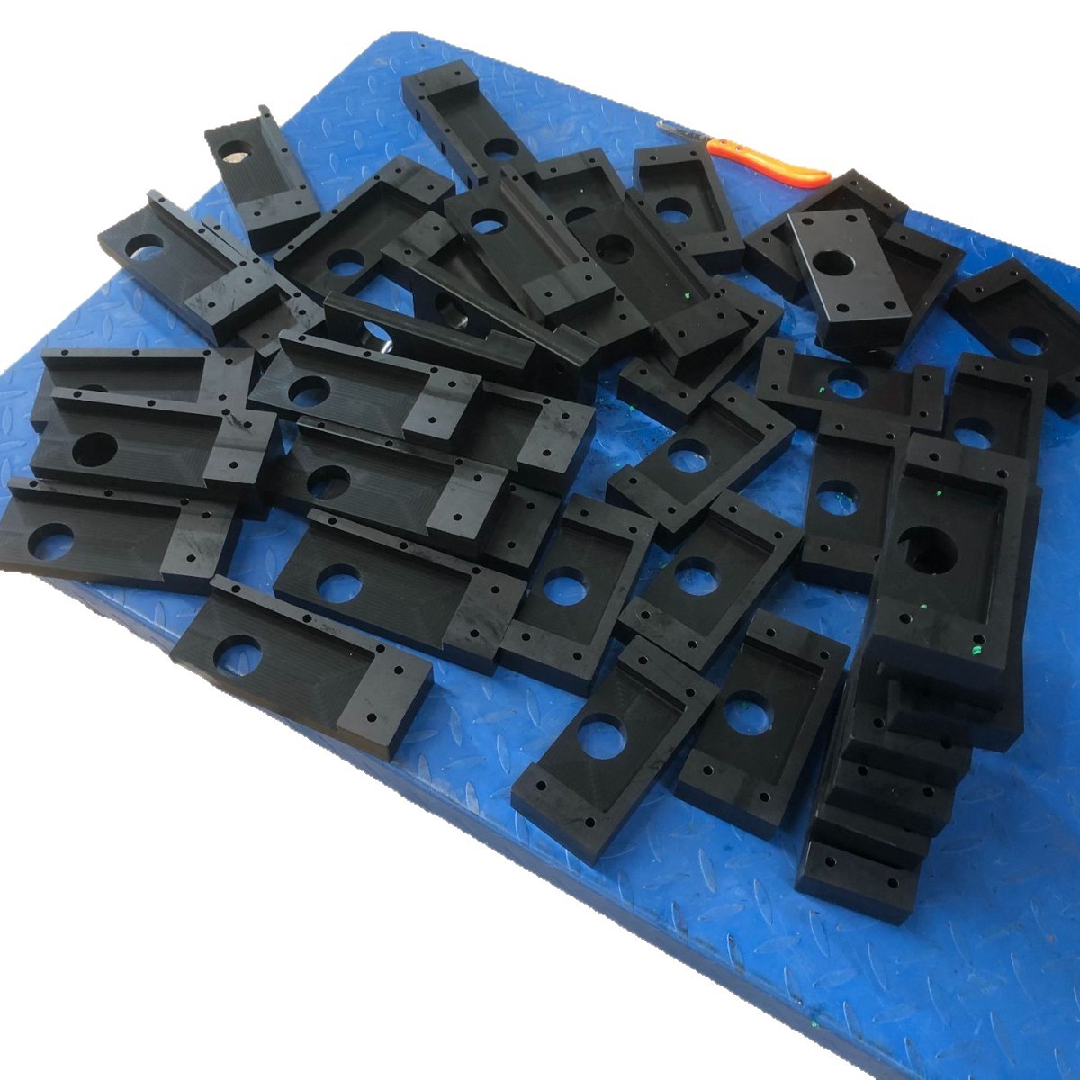 Batch of CNC machined POM brackets and blocks