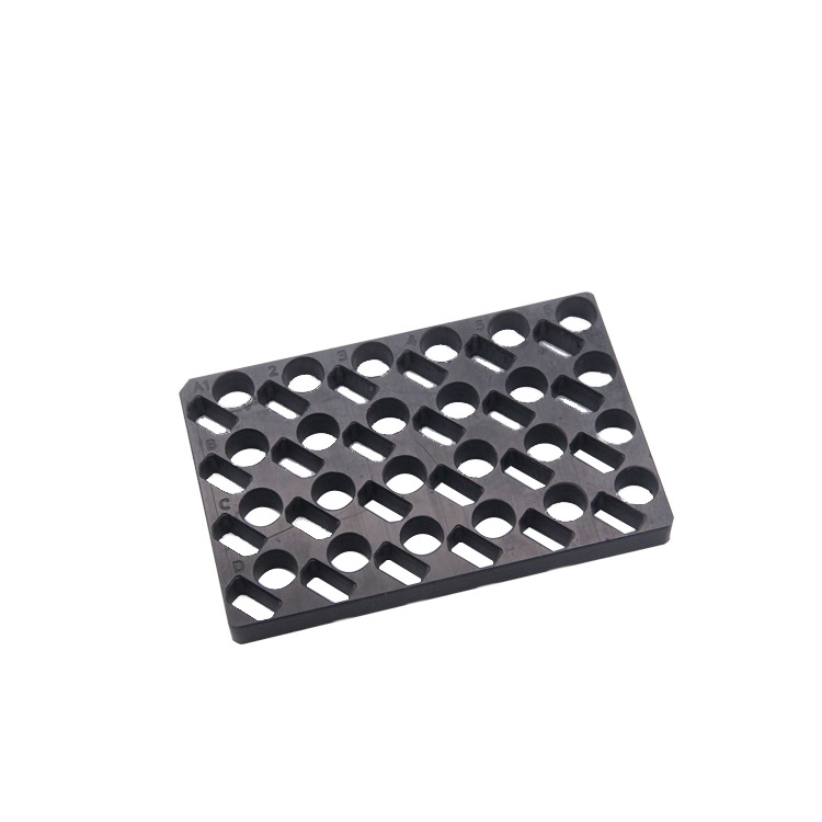CNC machined POM tray with indexed holes and slots