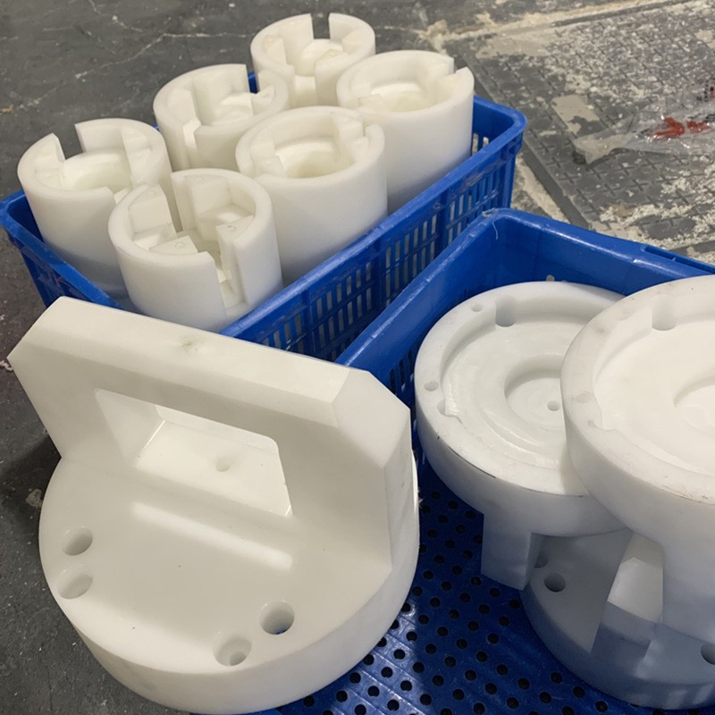 CNC machined white POM parts in crates