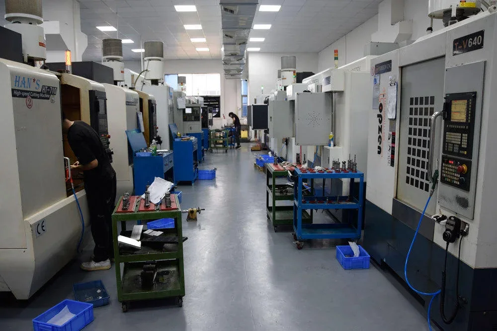 Machinist at a vertical machining centre in the GY Machining milling bay, Dongguan