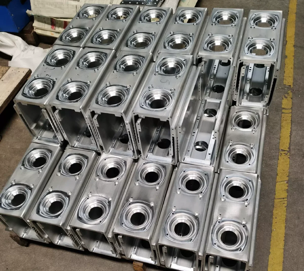 Production batch of CNC milled aluminium housings on a pallet, ready for inspection – GY Machining
