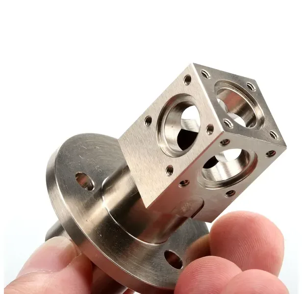 Stainless steel valve body with flange and cross-bored ports, machined and CMM inspected at GY Machining