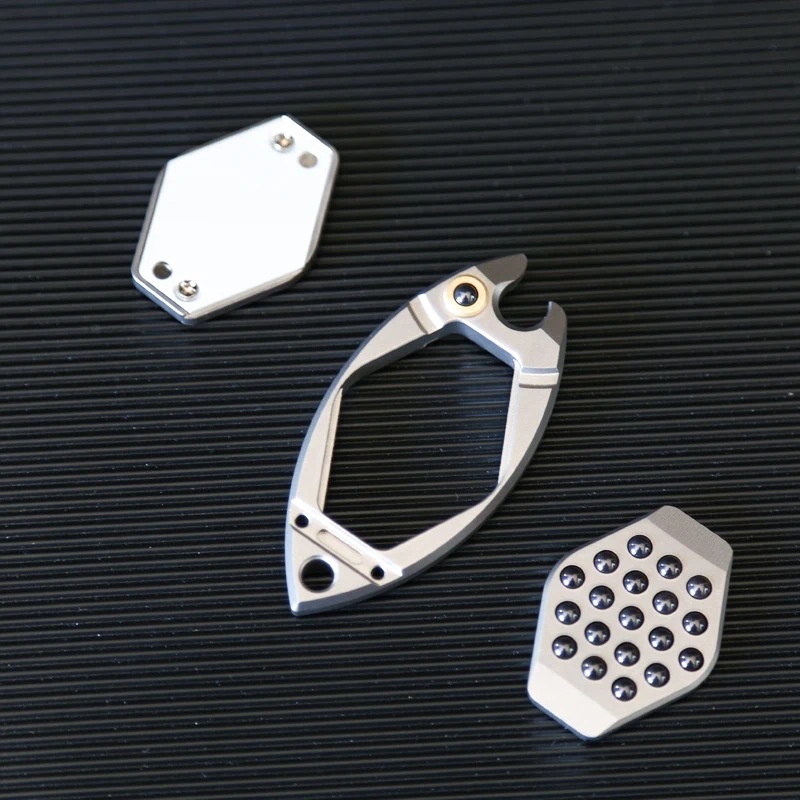 Machined titanium bottle opener with titanium scales and hardware