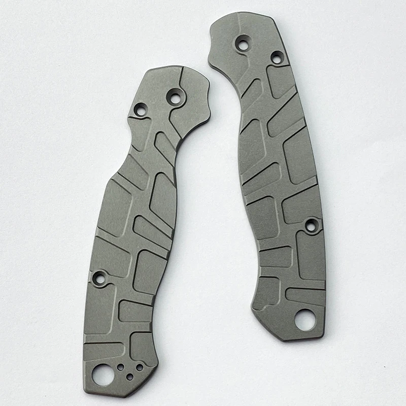 Pair of machined titanium knife handle scales with a milled geometric pattern and stonewashed finish, made by GY Machining