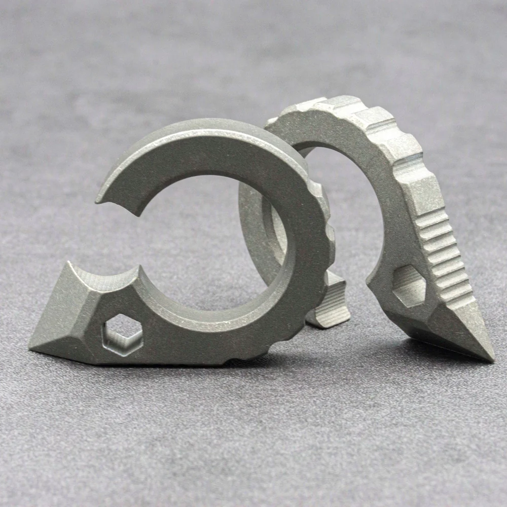 Pair of stonewashed titanium carabiner tools with faceted, serrated bodies
