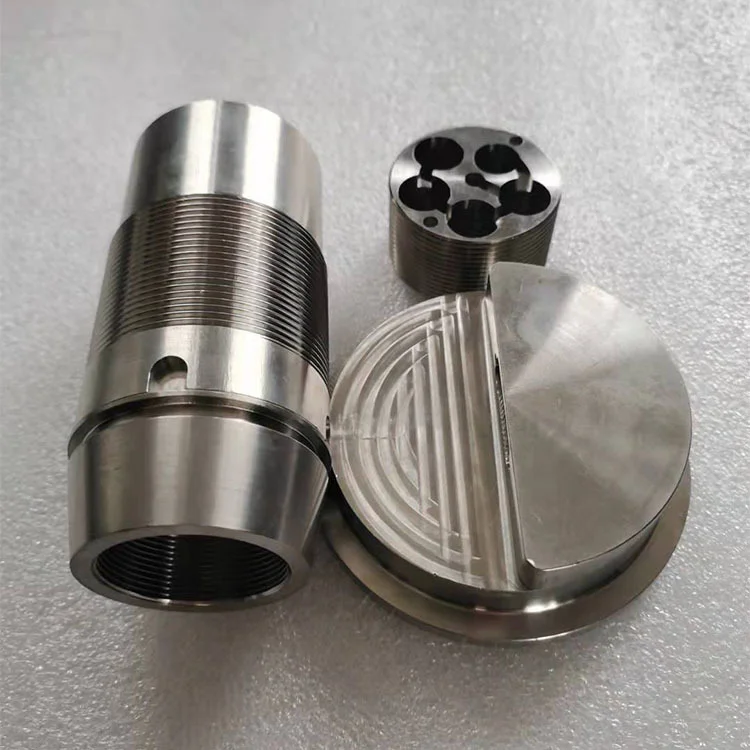 Machined titanium threaded housing and grooved disc, as-machined finish