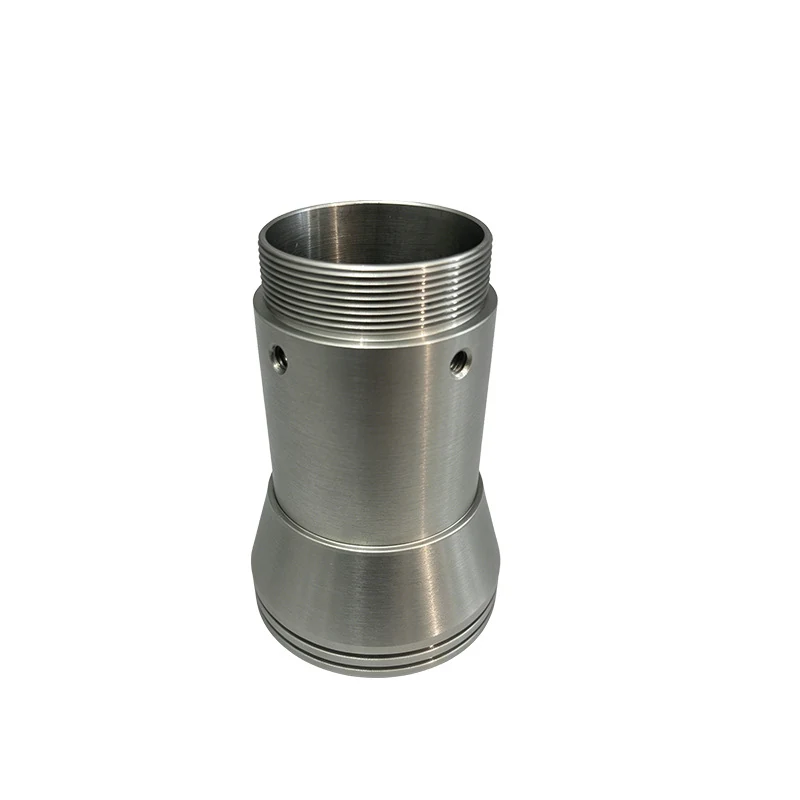 Turned stainless steel sleeve body with a coarse external thread, stepped skirt and cross-drilled side holes